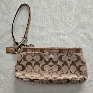 Gently used Coach Tan and Brown Signature Wristlet